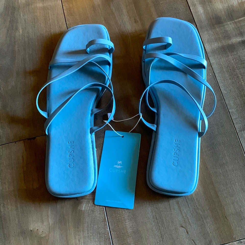 Blue laced flip flops